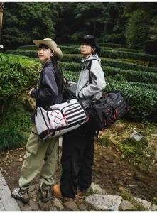 Outdoor travel duffel bag detail, showing spacious capacity and multi-functional design.