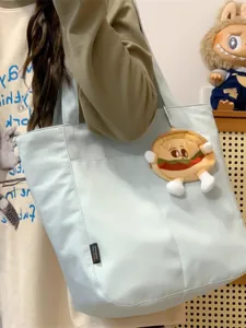 Casual canvas tote bag for women, large capacity shoulder bag, stylish daily commute.