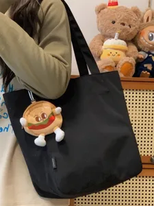 Japanese style minimalist black canvas tote bag for women, large capacity casual shoulder bag.