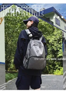Detailed view of grey waterproof lightweight outdoor casual backpack showcasing strap and design.