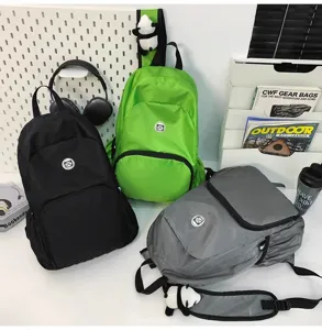 Detailed view of casual waterproof outdoor backpacks in multiple colors with cute panda charms.