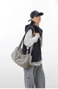 Lightweight casual crossbody travel bag for women, large capacity shoulder bag with drawstring.