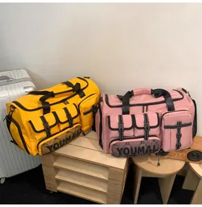 Multi-pocket travel duffel bag detail showcasing large capacity and durable webbing straps.