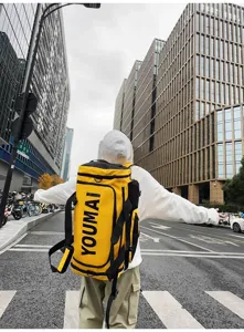 Großer gelber Reise-Rucksack für Damen und Herren, stilvolle zylindrische Pendler-Tasche.