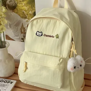 Japanese style sweet casual backpack for women, cute school bag with plush pendant.