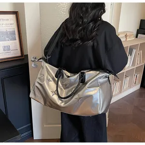 Large capacity silver metallic travel duffel bag with stylish star decor for gym and trips.