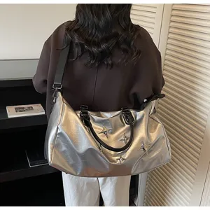 Large capacity silver travel duffel bag with stylish star studs for short trips and gym.
