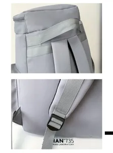 Detailansicht des grauen Rucksacks mit Schultergurten und robuster Kunststoffschnalle.
