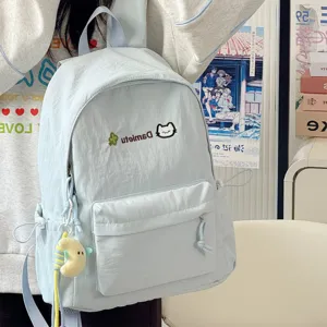 Detailed view of the cute light blue casual backpack featuring adorable cat embroidery.