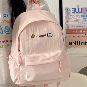 Pink Japanese style casual canvas backpack with cute cat embroidery and front pocket detail