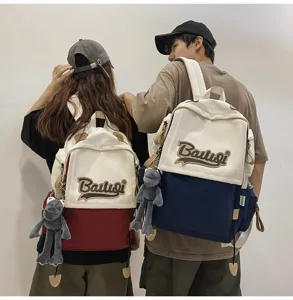 Casual canvas backpack for women and men, large capacity school bag with stylish contrast color design.