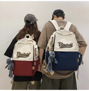 Casual canvas backpack for students, large capacity couple book bag with cute pendant.