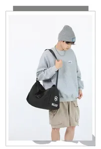Large capacity black sports duffel bag for gym, travel, and fitness. Durable and stylish.