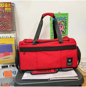 Red black sports duffel travel bag detail, large capacity gym fitness luggage storage.