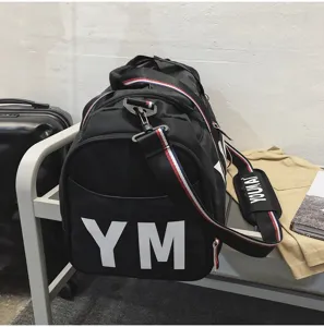 Detailed view of the black travel duffel gym bag showing large capacity and sturdy straps.