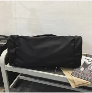 Large capacity black travel duffel bag for men and women fitness gym weekend trip storage.