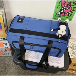Large capacity travel duffel bag with durable shoulder straps for gym, sports and daily use.