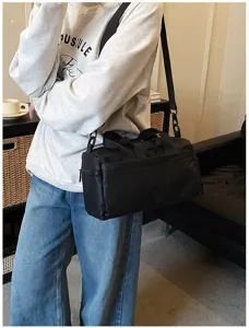 Black waterproof sports gym duffel bag, portable travel crossbody bag for men and women.