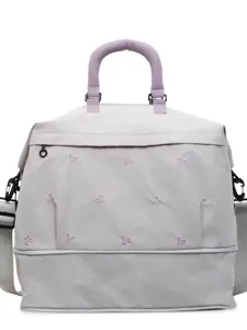 Large capacity travel duffel bag with cute bow embroidery and expandable bottom design.