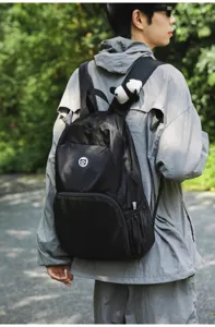 Outdoor lightweight waterproof backpack detail view, casual large capacity travel rucksack design.