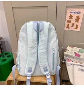 Lightweight minimalist solid color casual college student school backpack with side zipper pocket.