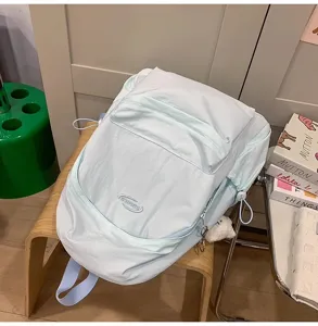 Casual light solid color backpack detail showcasing stylish design and durable material for students.
