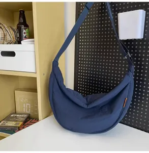 Large capacity navy blue dumpling crossbody bag, casual nylon shoulder bag for daily use.