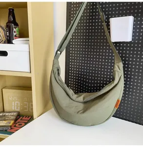 Green nylon dumpling crossbody bag for women, large capacity casual daily shoulder bag.