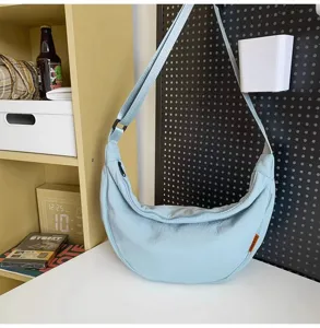 Light blue casual nylon dumpling shoulder bag, large capacity crossbody bag for daily use.