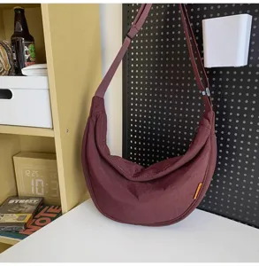 Casual solid color crescent crossbody bag, large capacity stylish dumpling shoulder bag for daily use.