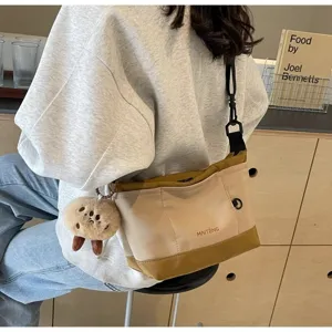 Retro casual canvas crossbody bag for women, fashion niche design messenger shoulder bag.