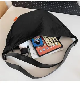 Black nylon crescent crossbody bag with large capacity, casual shoulder bag for daily use.
