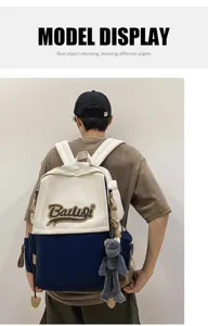 Casual canvas backpack with frog pendant, large capacity school bag for men and women.