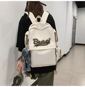 Detailed view of the casual canvas backpack for women, featuring large capacity and side pockets.