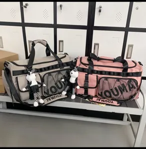 Large capacity travel duffel bag detail, sports gym bag with wet dry compartment and pockets.