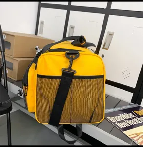 Detailed view of yellow gym duffel bag with mesh pocket, spacious travel sports bag for daily use.