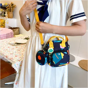 Japanese style canvas crossbody bag detail shot, featuring vibrant print and cute pendant.