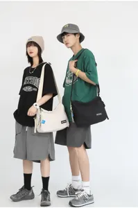 Japanese style solid color canvas crossbody bag casual shoulder bag for students and unisex use