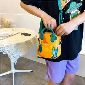 Chic Japanese style canvas crossbody bag featuring colorful flower print, versatile bag.