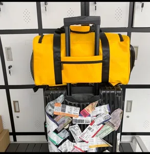 Yellow travel duffel bag with luggage sleeve and sturdy handles for gym and weekend trips.