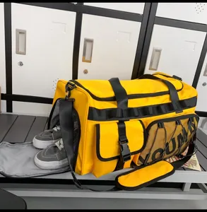 Large capacity yellow sports duffel bag with separate shoe compartment and multiple pockets for travel.