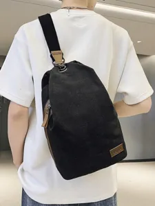 Sac bandoulière en toile noire pour hommes et femmes, sac de poitrine rétro de grande capacité.