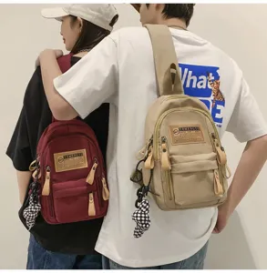 Canvas chest bag for men and women, casual stylish crossbody backpack with multiple pockets.