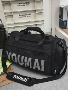 Black travel duffel bag detail, large capacity gym sports bag with shoulder strap.