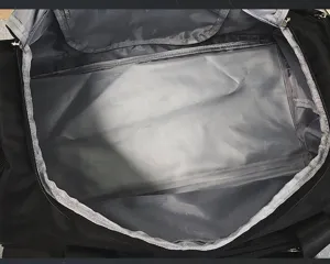 Interior view of large capacity black travel duffel bag with spacious compartment for gym.