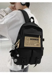 Schwarzer wasserdichter Rucksack mit grossem Fassungsvermögen und niedlichem Affenanhänger.