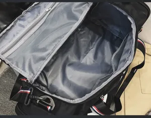 Detailed interior view showing large capacity and mesh compartments of travel fitness bag.