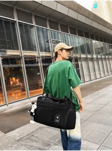 Large capacity black travel duffel bag for men, gym sports bag with shoulder strap.