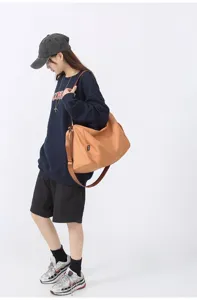 Large capacity casual canvas travel duffel bag with adjustable strap for gym sports.