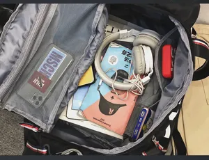 Travel duffel bag interior detail showing large capacity storage compartments and neat organization.